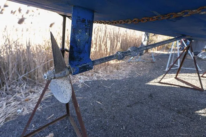 Slide: The Image of Propeller and rudder of a 1991 Beneteau First 310 sailboat on dry dock. - 7
