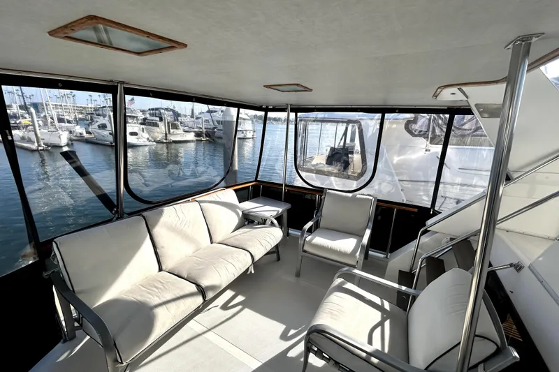 Slide: The Image of Spacious interior of 1989 Ocean Alexander 44 CPMY yacht with marina view. - 10