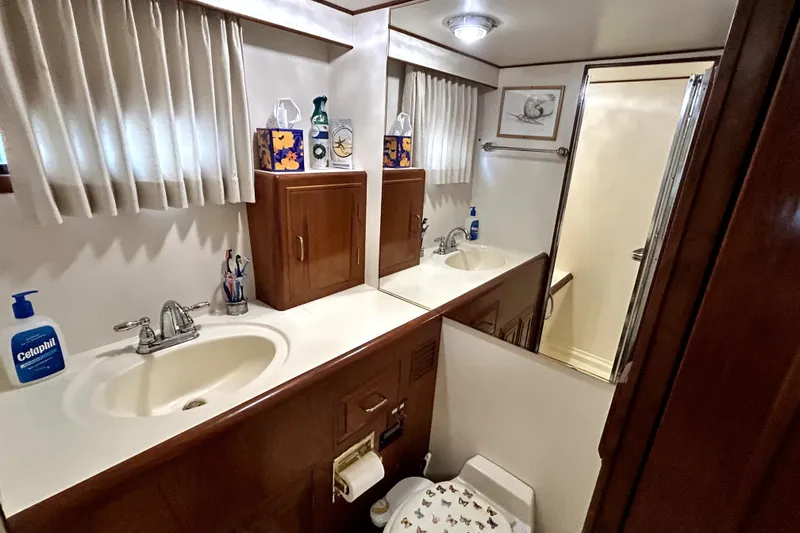 Slide: The Image of Luxurious bathroom in 1989 Ocean Alexander 44 CPMY yacht with dual sinks and shower. - 14