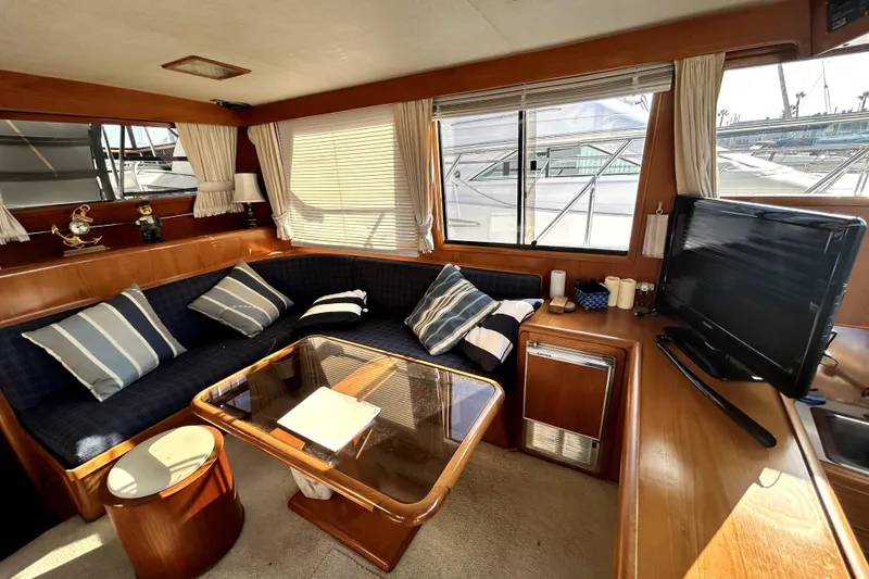 Slide: The Image of Luxurious interior of 1989 Ocean Alexander 44 CPMY yacht with cozy seating and modern amenities. - 3