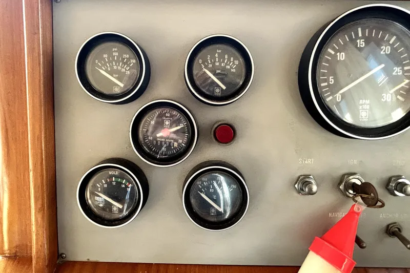 Slide: The Image of Dashboard of 1989 Ocean Alexander 44 CPMY with gauges and ignition key. - 34