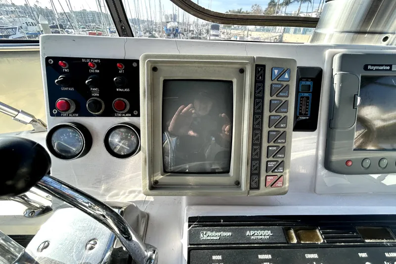 Slide: The Image of Control panel of a 1989 Ocean Alexander 44 CPMY yacht with navigation instruments. - 38