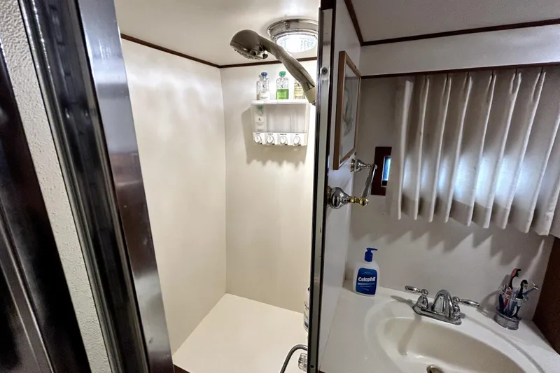 Slide: The Image of Bathroom interior of 1989 Ocean Alexander 44 CPMY yacht with shower and sink. - 16