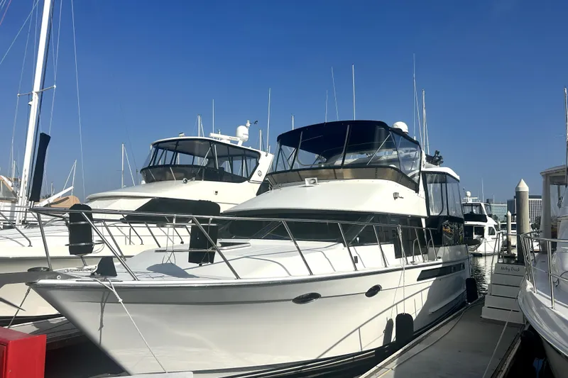 Slide: The Image of 1989 Ocean Alexander 44 CPMY yacht docked at marina under clear blue sky. - 17
