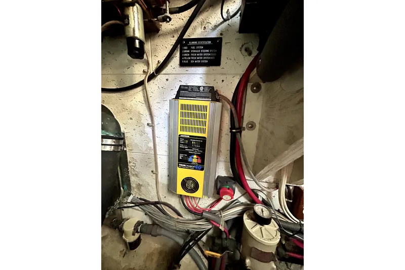 Slide: The Image of Engine room of 1989 Ocean Alexander 44 CPMY with electrical components and wiring. - 27