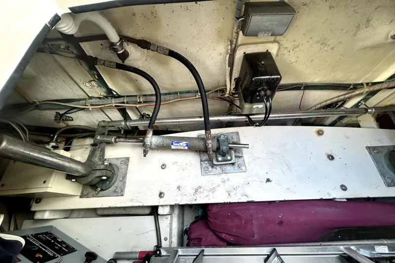 Slide: The Image of Engine room of 1989 Ocean Alexander 44 CPMY with visible mechanical components and wiring. - 31