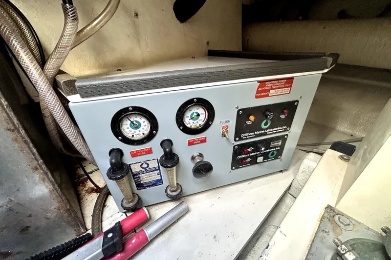 Slide: The Image of Control panel in 1989 Ocean Alexander 44 CPMY yacht engine room, featuring gauges and switches. - 32