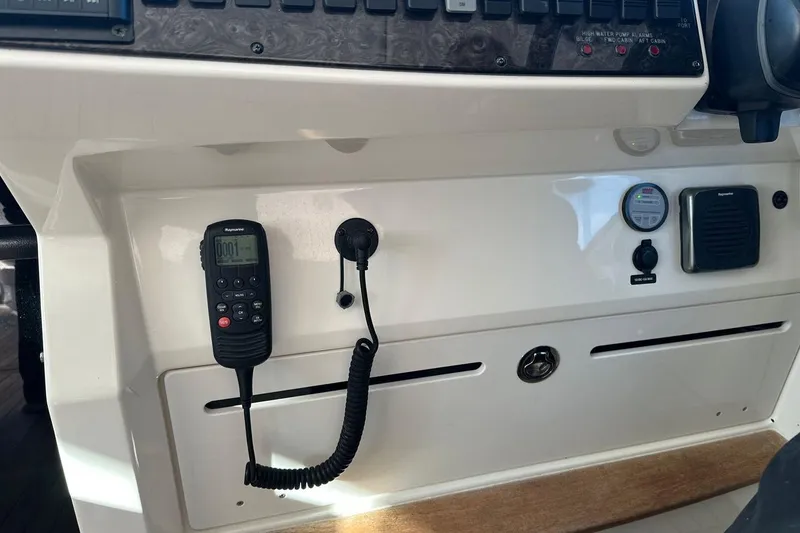 Slide: The Image of Control panel of 2014 Sea Ray 410 Sundancer with radio and gauges. - 20