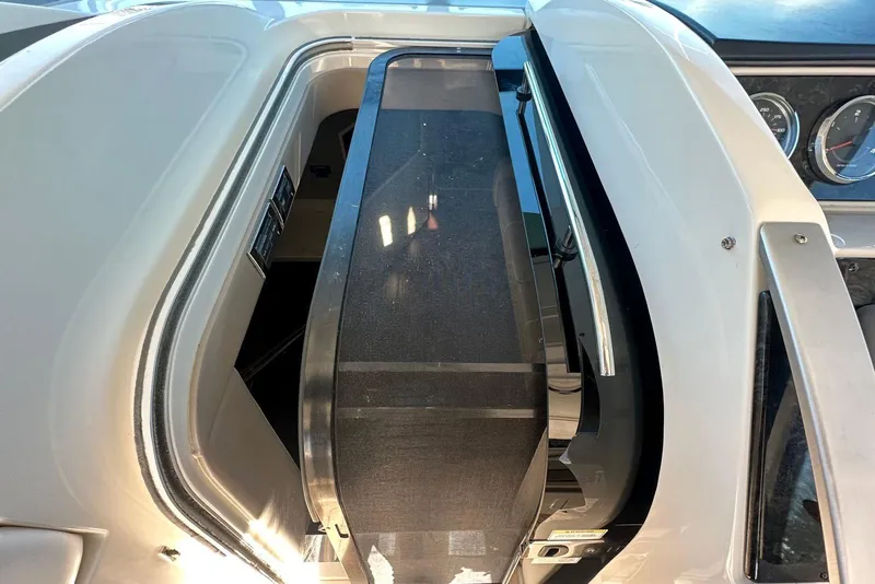 Slide: The Image of 2014 Sea Ray 410 Sundancer dashboard with sleek design and modern controls. - 21