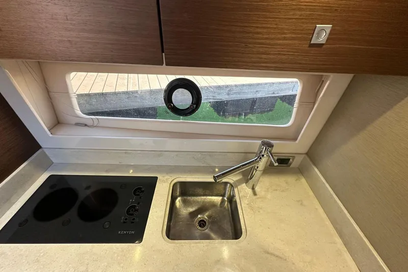 Slide: The Image of Modern kitchen area in 2014 Sea Ray 410 Sundancer yacht with sink and stove. - 24