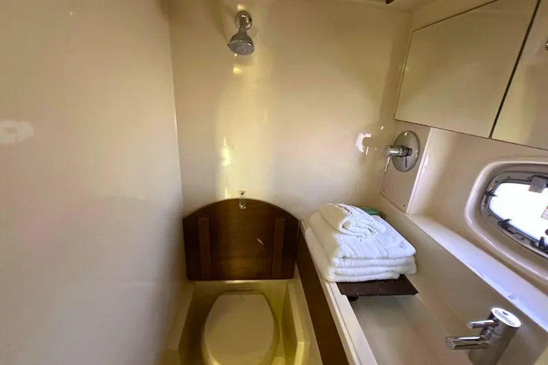 Slide: The Image of Bathroom interior of 2014 Sea Ray 410 Sundancer yacht with shower and towels. - 29