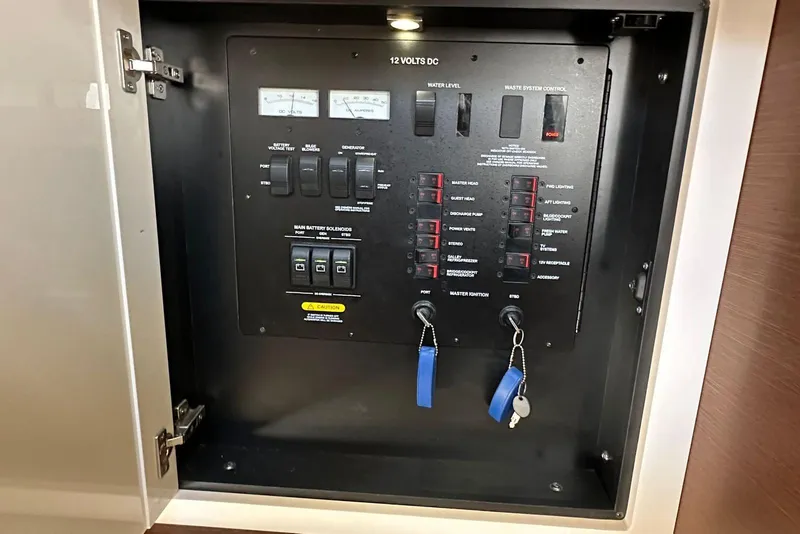 Slide: The Image of Electrical control panel inside a 2014 Sea Ray 410 Sundancer yacht. - 34