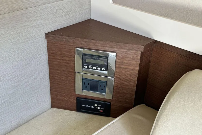 Slide: The Image of Control panel and outlets in 2014 Sea Ray 410 Sundancer yacht interior. - 35