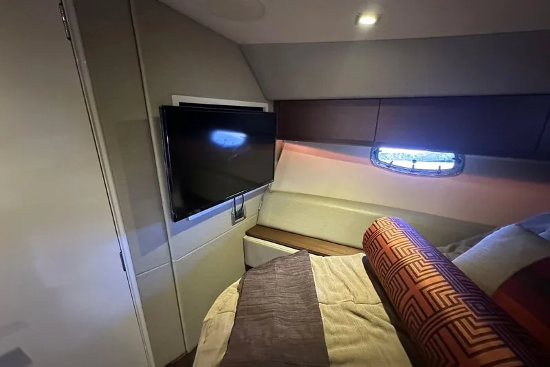 Slide: The Image of Luxurious cabin interior of 2014 Sea Ray 410 Sundancer with TV and window. - 39