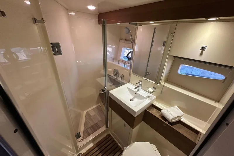 Slide: The Image of Luxurious bathroom interior of 2014 Sea Ray 410 Sundancer yacht with modern fixtures. - 41
