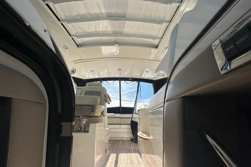Slide: The Image of Interior view of 2014 Sea Ray 410 Sundancer yacht, featuring sleek design and modern seating. - 49