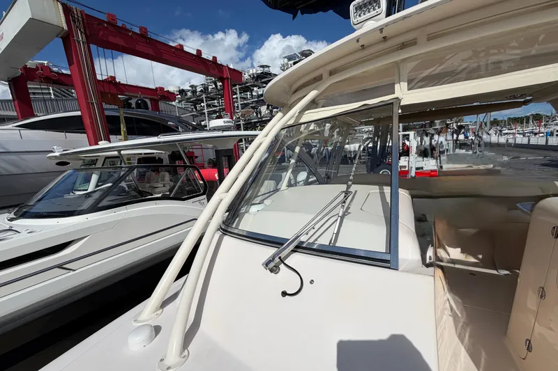 Slide: The Image of 2013 Grady-White Freedom 335 boat interior with seating and storage compartments. - 105