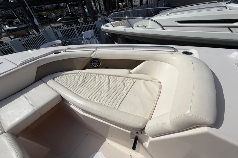 Slide: The Image of 2013 Grady-White Freedom 335 boat with open storage compartment and Yamaha engines. - 106