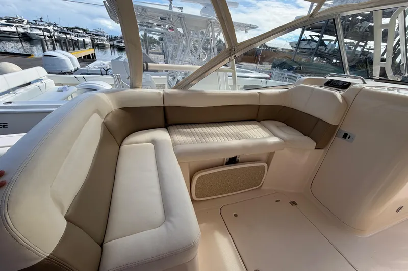 Slide: The Image of 2013 Grady-White Freedom 335 boat interior with foldable seat and table. - 109