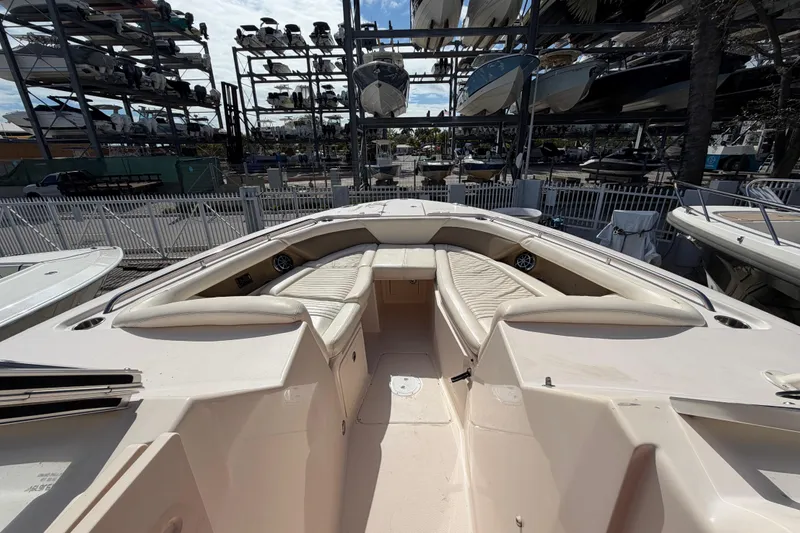 Slide: The Image of 2013 Grady-White Freedom 335 boat deck with seating and storage compartments. - 116