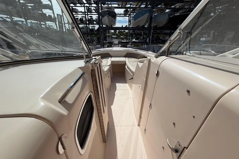 Slide: The Image of 2013 Grady-White Freedom 335 boat interior with seating and storage compartments. - 117
