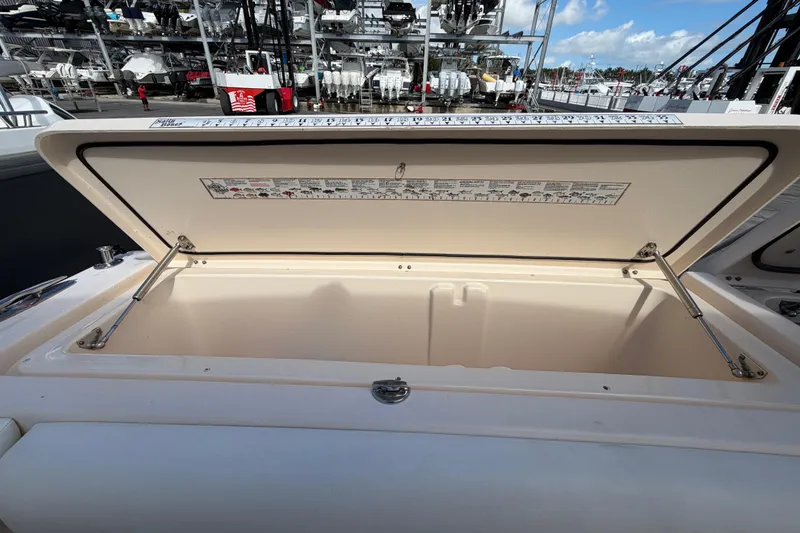 Slide: The Image of 2013 Grady-White Freedom 335 boat interior with seating and Yamaha outboard engines. - 120