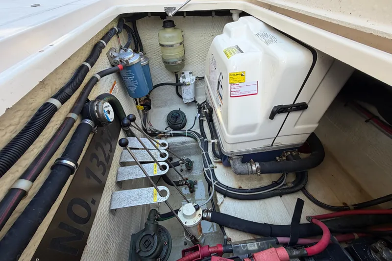 Slide: The Image of 2013 Grady-White Freedom 335 boat with dual outboard motors on a concrete surface. - 124