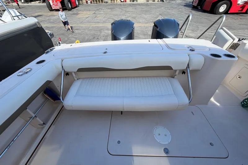 Slide: The Image of 2013 Grady-White Freedom 335 boat docked with stacked boats in background. - 127