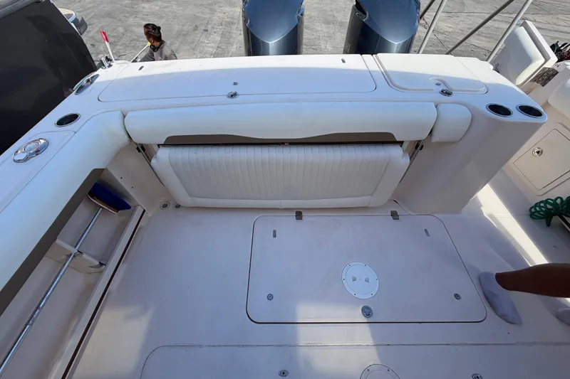 Slide: The Image of 2013 Grady-White Freedom 335 boat in marina with stacked boats and clear sky. - 128