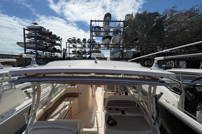 Slide: The Image of 2013 Grady-White Freedom 335 boat logo and emblem on hull. - 139