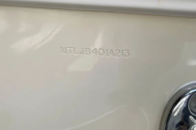 Slide: The Image of 2013 Grady-White Freedom 335 boat stern with dual outboard motors. - 14