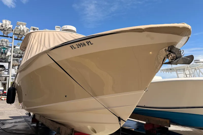 Slide: The Image of 2013 Grady-White Freedom 335 boat docked under clear blue sky. - 143