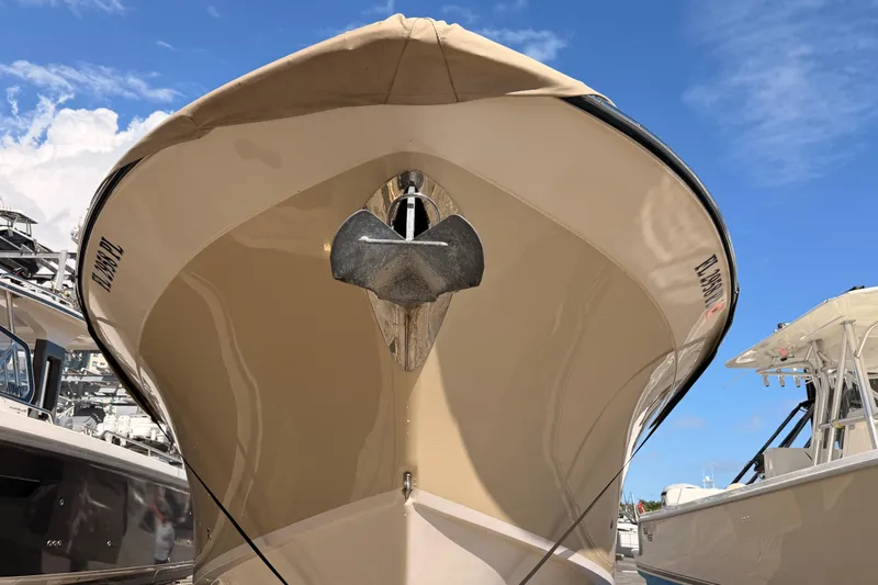 Slide: The Image of 2013 Grady-White Freedom 335 boat covered and docked in a marina. - 153