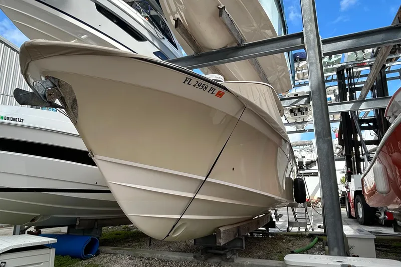 Slide: The Image of 2013 Grady-White Freedom 335 boat stored in a marina rack. - 2