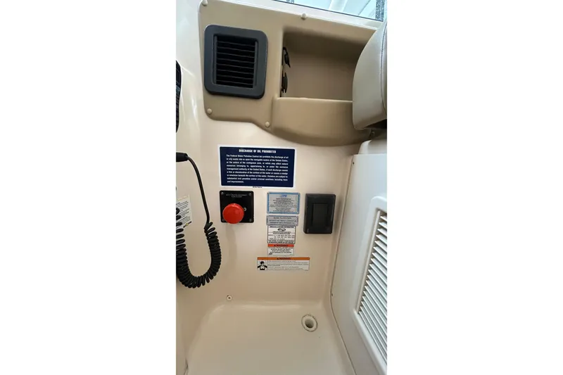 Slide: The Image of 2013 Grady-White Freedom 335 boat battery compartment with wiring and components. - 22