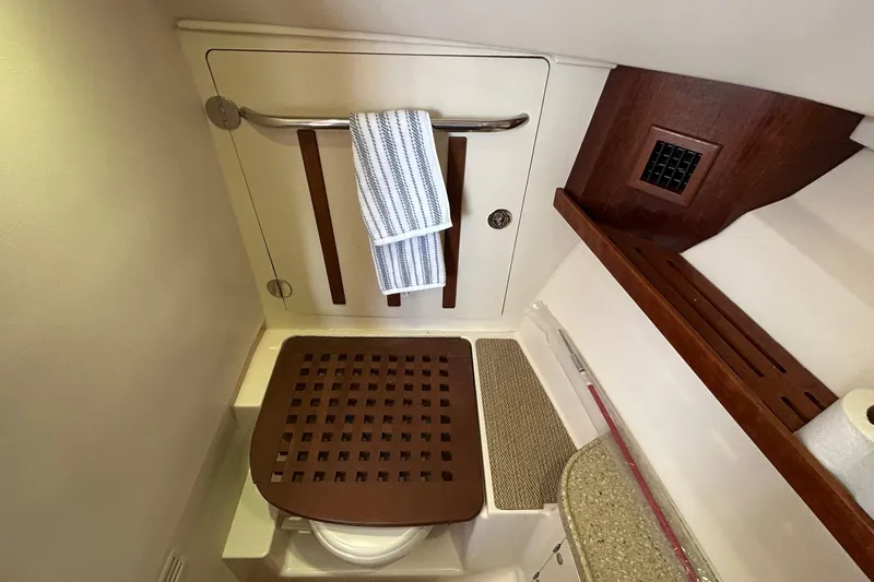 Slide: The Image of Interior view of 2013 Grady-White Freedom 335 boat ceiling with hatches and netting. - 27