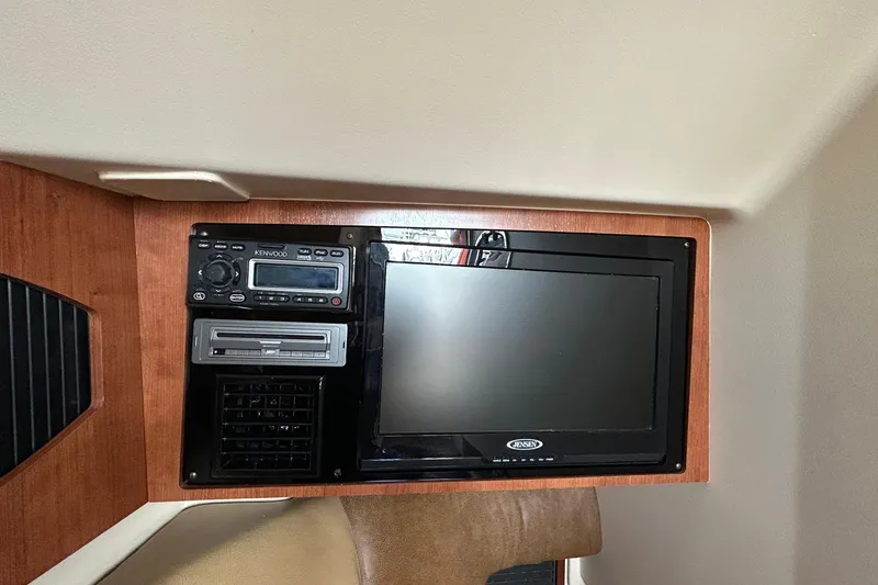 Slide: The Image of 2013 Grady-White Freedom 335 boat interior with sink and storage area. - 31