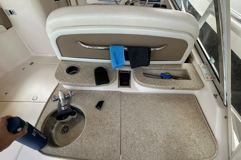 Slide: The Image of 2013 Grady-White Freedom 335 boat interior with open storage compartment. - 53