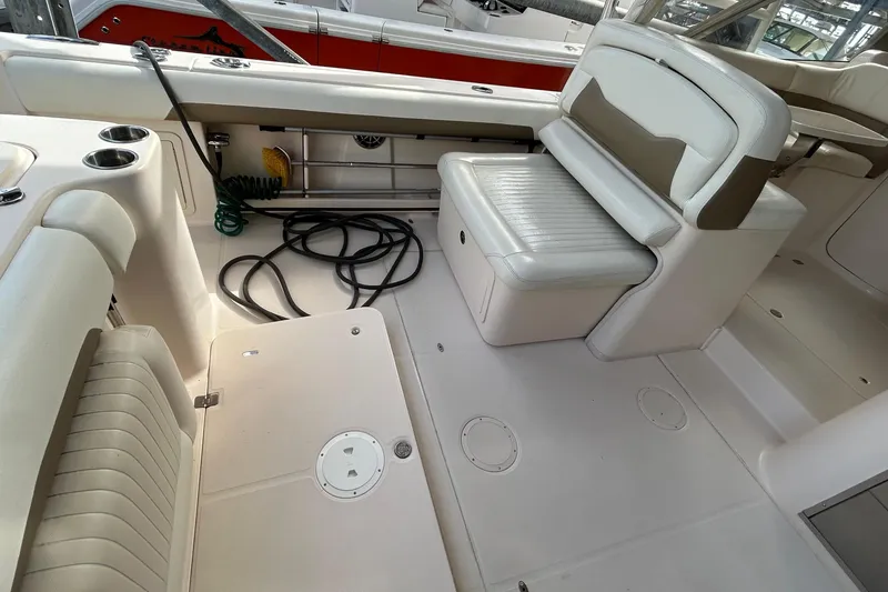 Slide: The Image of 2013 Grady-White Freedom 335 boat controls with Yamaha throttle and Kenwood audio system. - 57