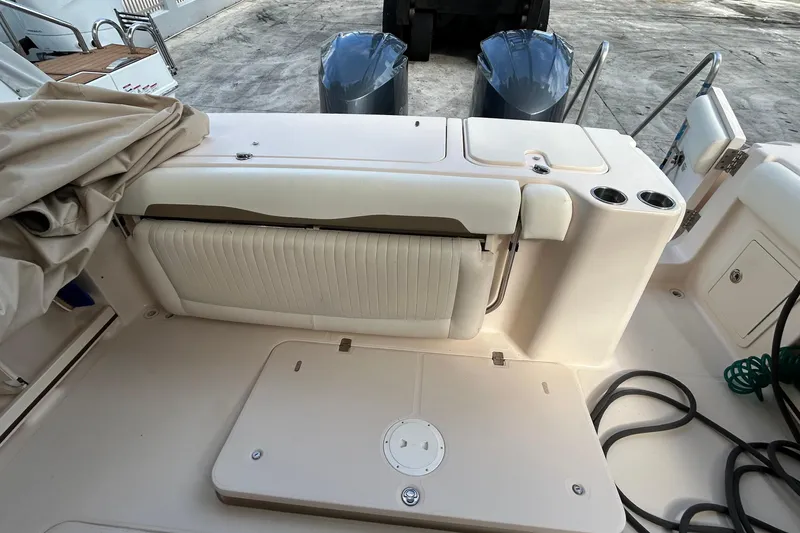 Slide: The Image of Dashboard of 2013 Grady-White Freedom 335 boat with compass and navigation controls. - 59