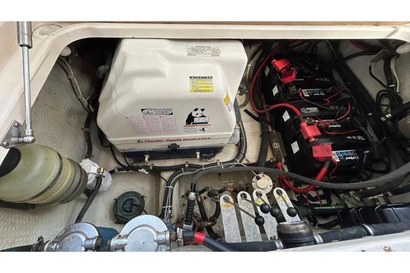 Slide: The Image of Dashboard of 2013 Grady-White Freedom 335 with Garmin displays and Kenwood audio system. - 60