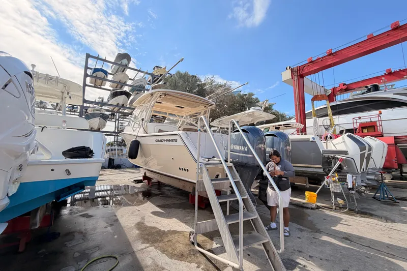 Slide: The Image of Dashboard of 2013 Grady-White Freedom 335 boat with control switches and GPS display. - 62