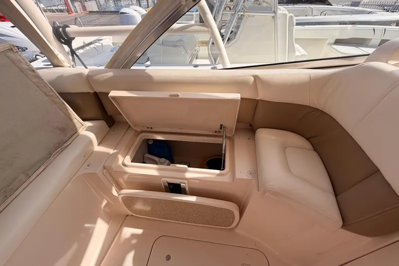 Slide: The Image of 2013 Grady-White Freedom 335 dashboard with Garmin navigation and control systems. - 63