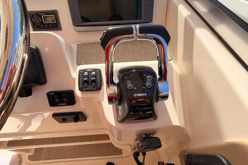 Slide: The Image of Interior of 2013 Grady-White Freedom 335 boat, featuring seating and helm area. - 66