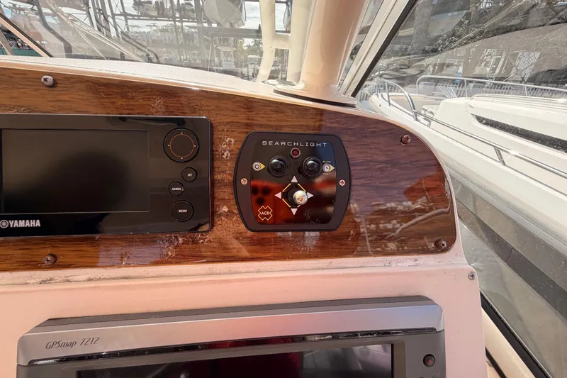 Slide: The Image of 2013 Grady-White Freedom 335 boat deck with storage compartment and cleaning tools. - 69