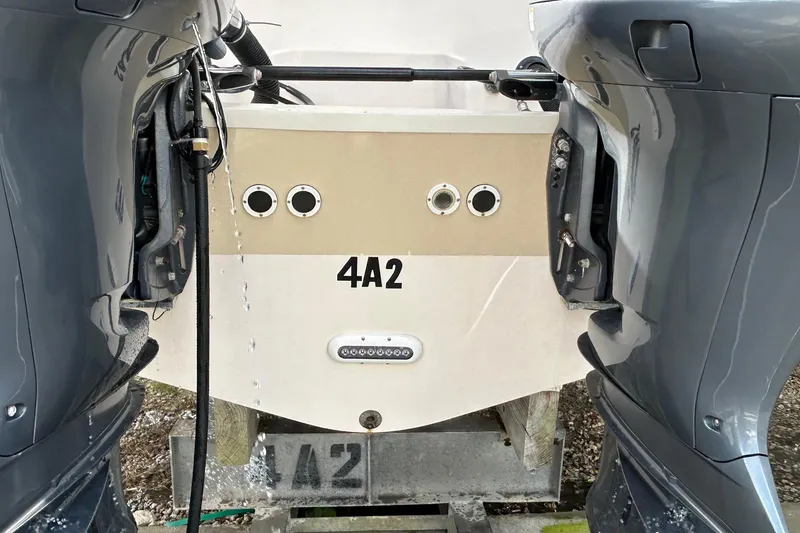 Slide: The Image of 2013 Grady-White Freedom 335 boat on dry dock, hull view, sunny day. - 7