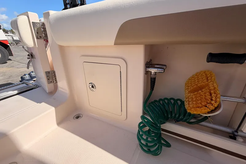 Slide: The Image of 2013 Grady-White Freedom 335 boat interior with white cushioned seating. - 80