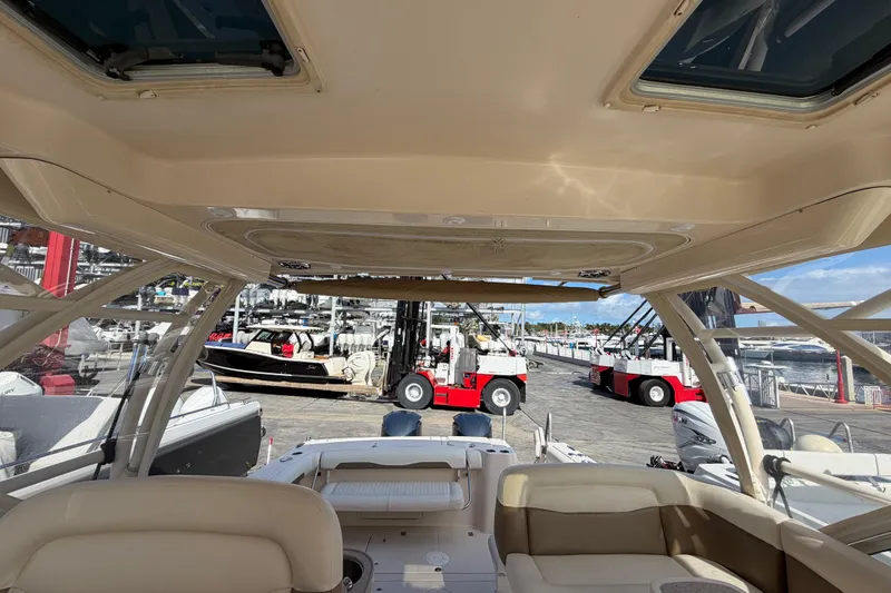 Slide: The Image of 2013 Grady-White Freedom 335 boat deck with fittings and hatches. - 86