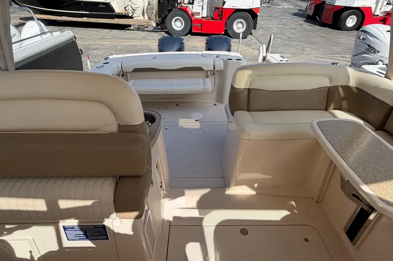 Slide: The Image of 2013 Grady-White Freedom 335 boat interior with seating and sink area. - 87