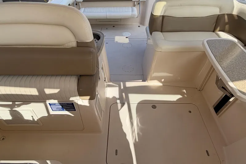 Slide: The Image of 2013 Grady-White Freedom 335 boat interior with seating and storage compartments. - 88